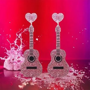 Sparkle with style: Pink guitar glitter‎ acrylic earrings